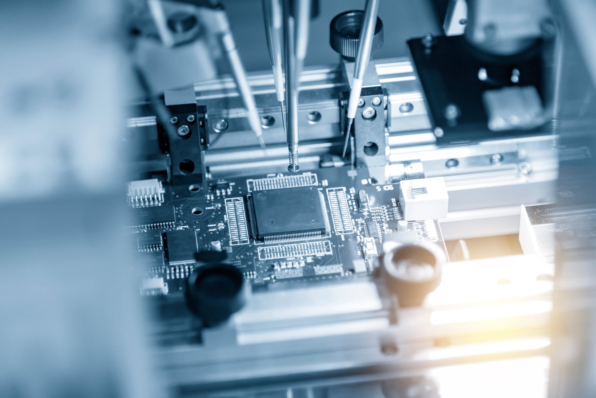 Close-up of a circuit board with electronic components in a blurred background