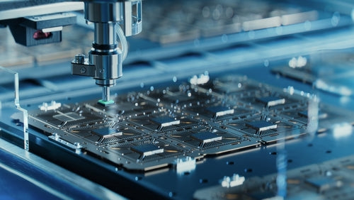 Manufacturing process of a circuit board with a machine in operation